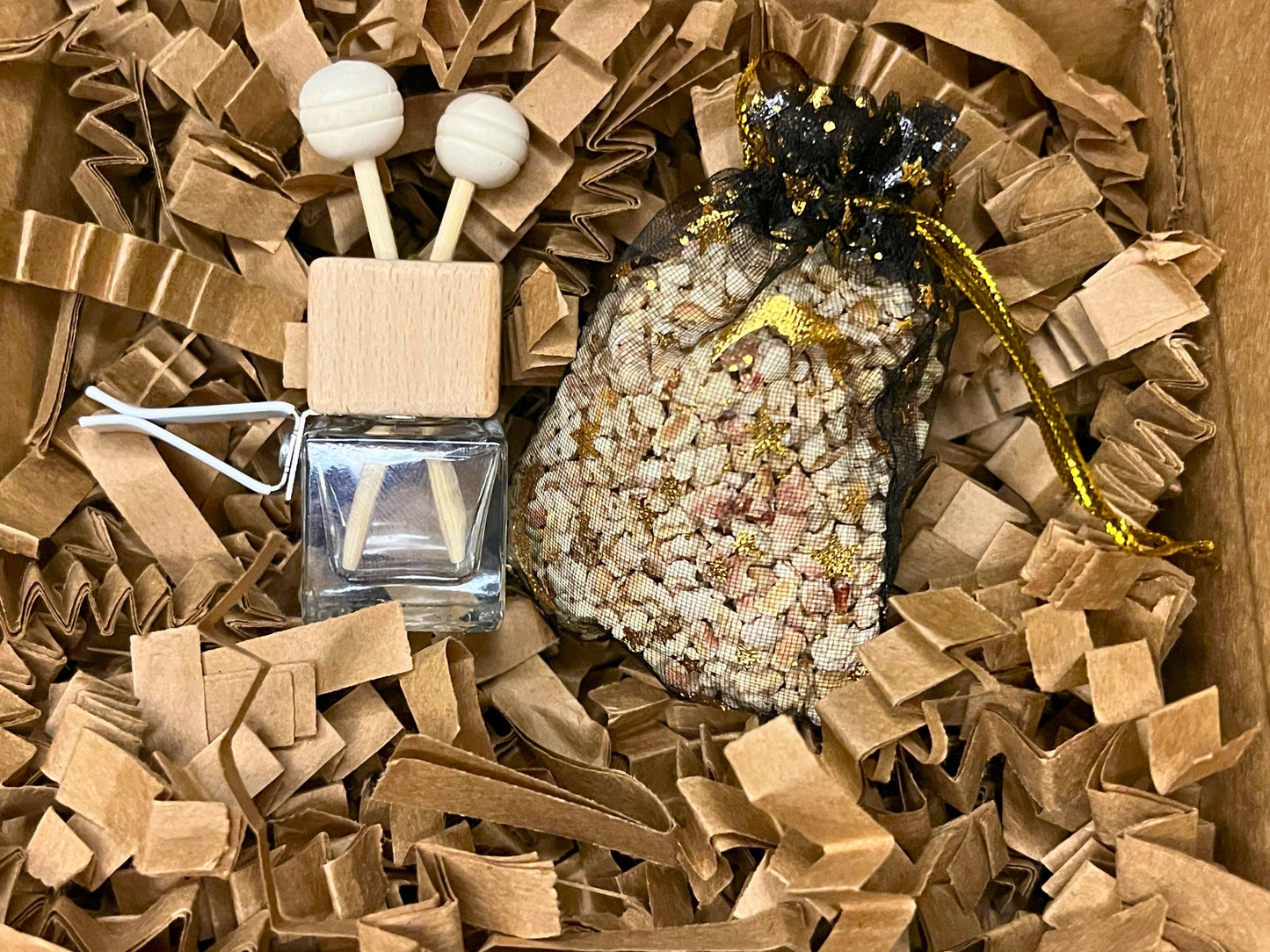 Customizable scent sachets in black mesh bags with gold accents. Handcrafted for closets, drawers, and cars. Long-lasting fragrance, ideal for gifts or refreshing small spaces. Made in the USA with care and premium quality materials.