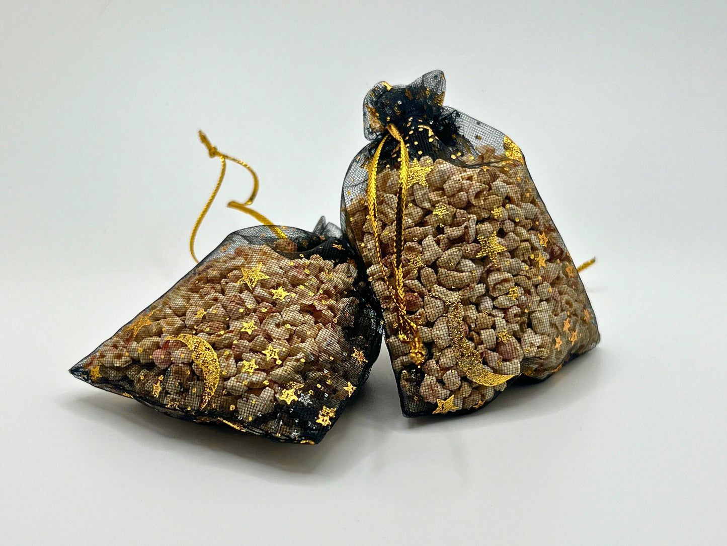 Customizable scent sachets in black mesh bags with gold accents. Handcrafted for closets, drawers, and cars. Long-lasting fragrance, ideal for gifts or refreshing small spaces. Made in the USA with care and premium quality materials.