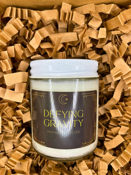 Hand-poured soy candle inspired by Wicked’s; Defying Gravity. Featuring bold, magical scents and a celestial moon and star label, it’s perfect for theater fans and those seeking an enchanting fragrance experience to elevate their space.