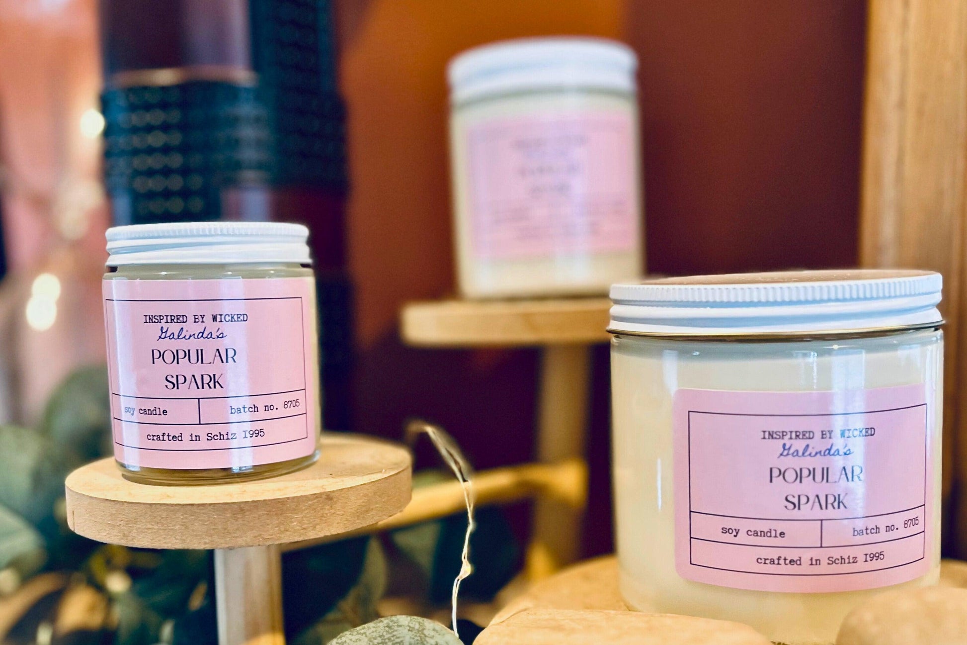Handcrafted soy candle inspired by Wicked's Galinda, featuring a Popular Spark pink label. Infused with enchanting fragrances, it adds a touch of magic and whimsy to your space. Perfect for unique gifting or personal enjoyment.