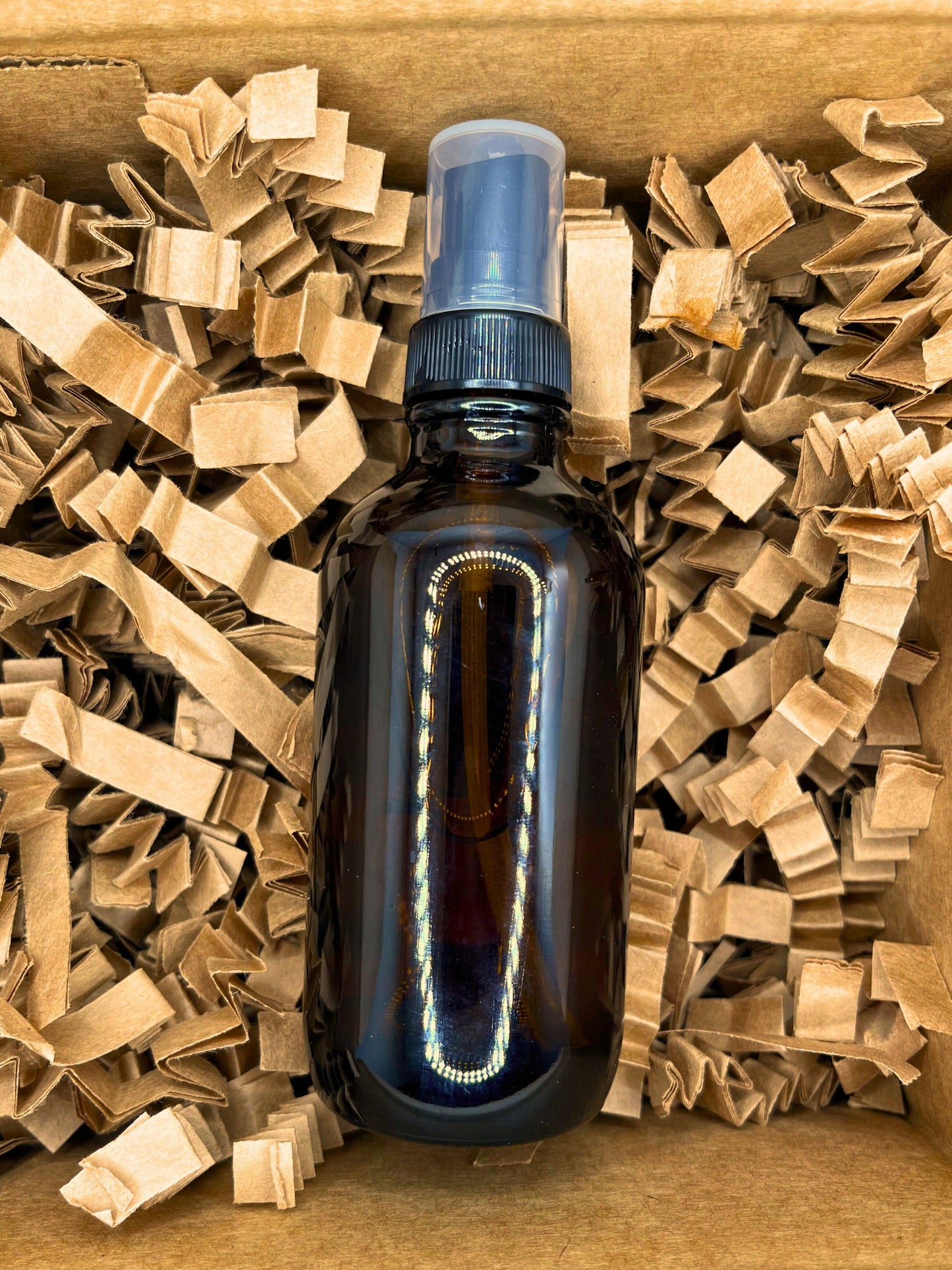 Amber spray bottle for Custom Room Spray. Handcrafted fragrance mist with personalized scents, long-lasting aromas, perfect for home or travel. Eco-friendly and USA-made, ideal for aromatherapy and creating a refreshing ambiance in any space.