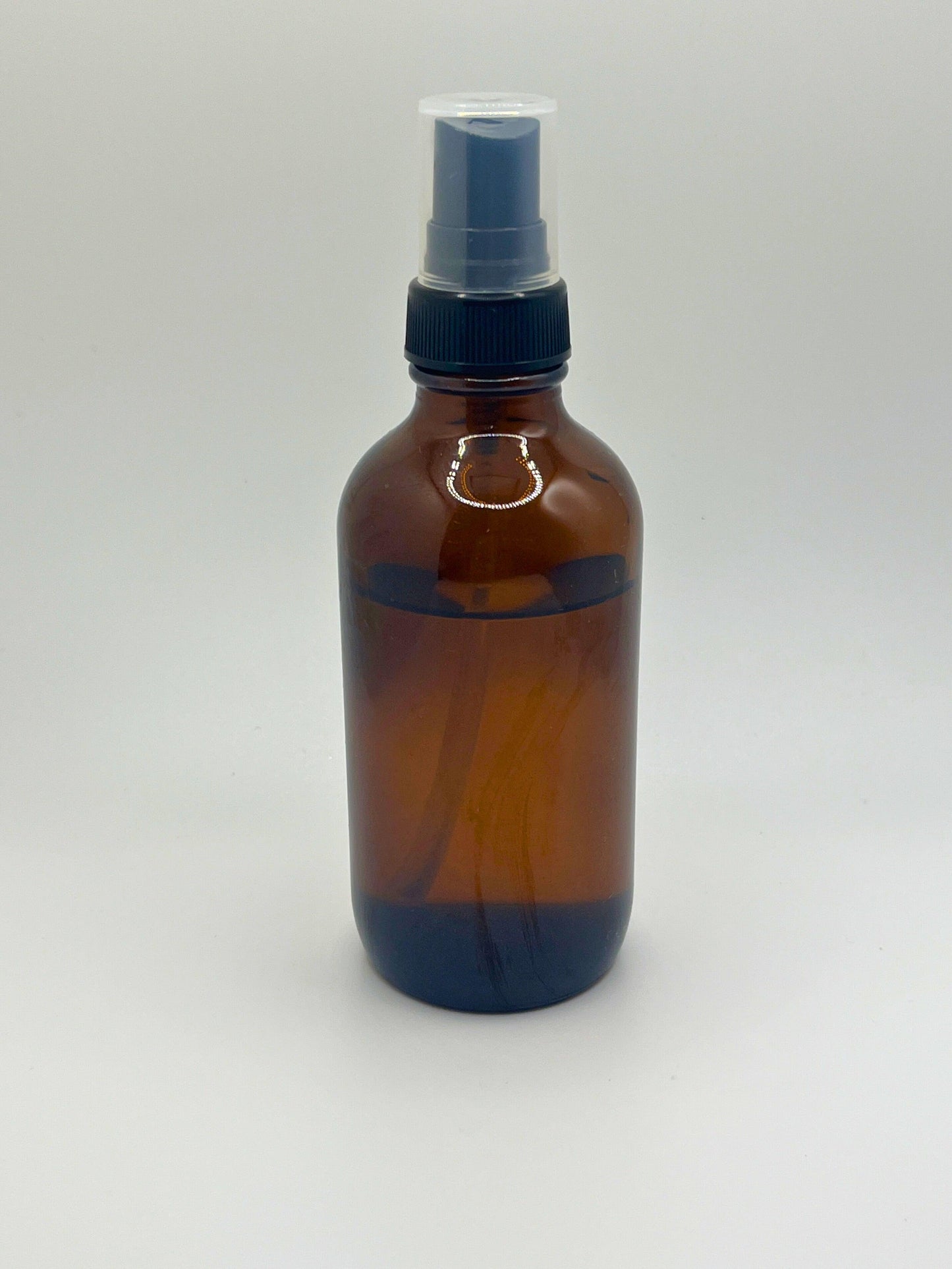 Amber spray bottle for Custom Room Spray. Handcrafted fragrance mist with personalized scents, long-lasting aromas, perfect for home or travel. Eco-friendly and USA-made, ideal for aromatherapy and creating a refreshing ambiance in any space.