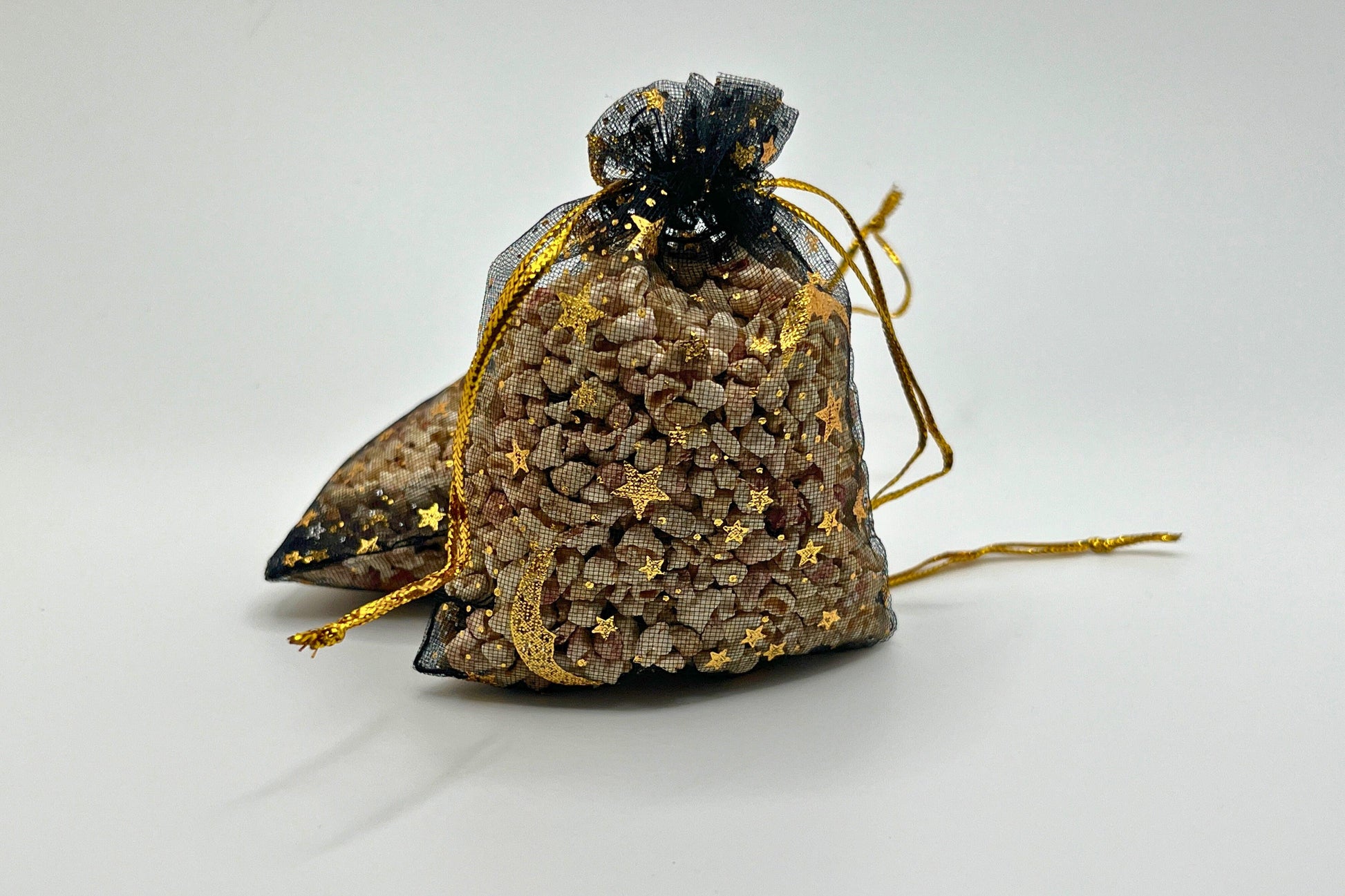 Customizable scent sachets in black mesh bags with gold accents. Handcrafted for closets, drawers, and cars. Long-lasting fragrance, ideal for gifts or refreshing small spaces. Made in the USA with care and premium quality materials.